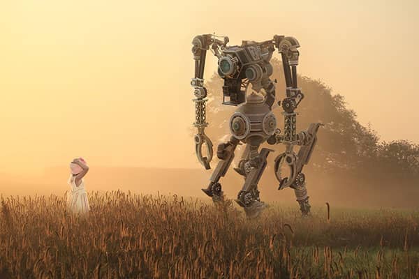 A girl in a field with a robot